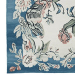 Close-up of the Floral Reverie Hand Knotted Rug, showcasing a vibrant floral design with soft pink and blue hues, perfect as a square area rug for living rooms. This wool rug features intricate patterns ideal for adding elegance to any space.