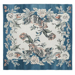 Square wool area rug featuring a floral design with soft pink and white flowers on a deep blue background, perfect for enhancing living room decor.