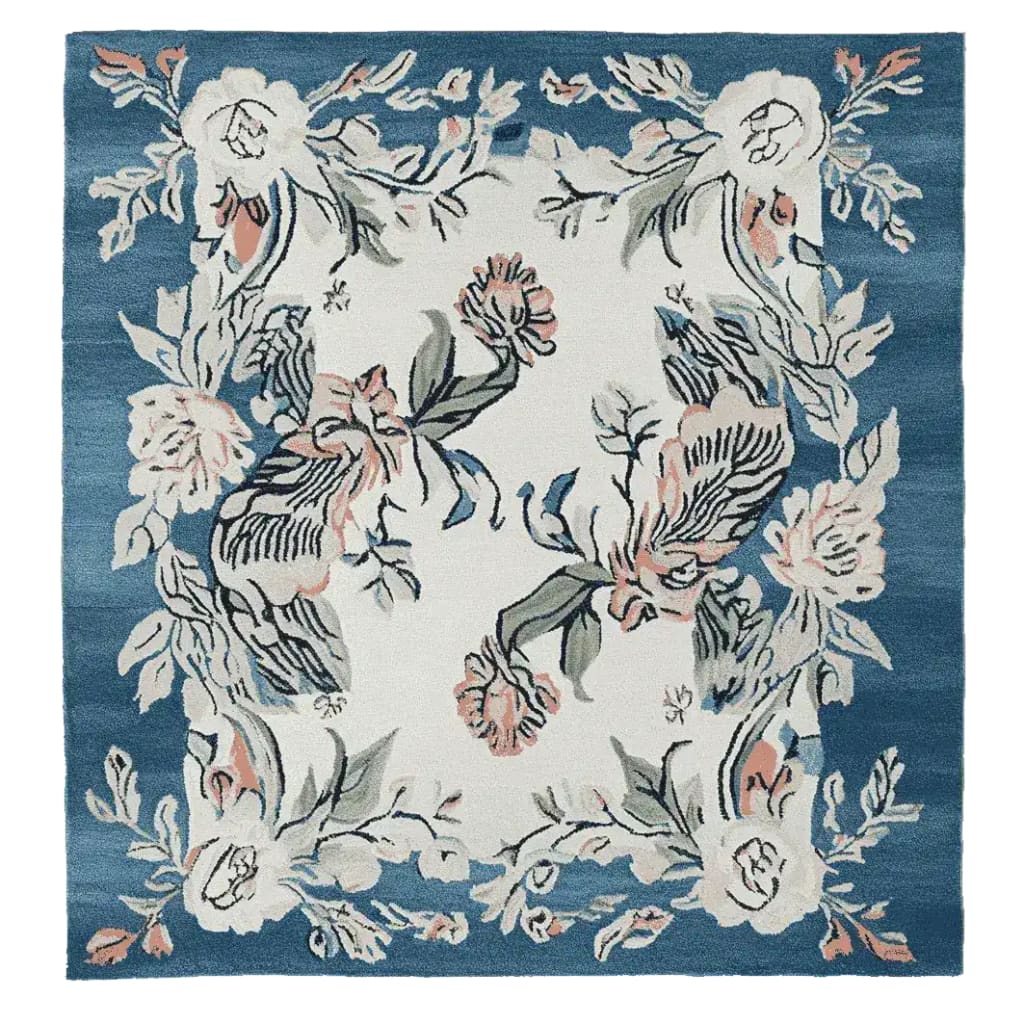 This beautiful Floral Reverie Hand Knotted Rug showcases an elegant design with intricate floral patterns, perfect for adding charm to any living space. The square area rug, crafted from high-quality wool, features a delightful combination of soft hues on a rich blue background, making it an ideal choice for area rugs in the living room.