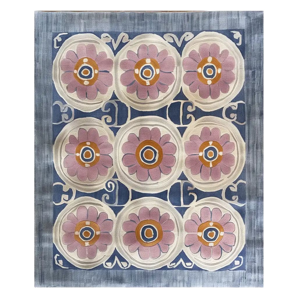 Top view of the Floral Revival Hand Tufted Wool Rug, showcasing its intricate design with large pink floral patterns against a blue and cream background. Perfect for adding a touch of elegance to any living room, this 8x10 area rug is crafted from high-quality wool.