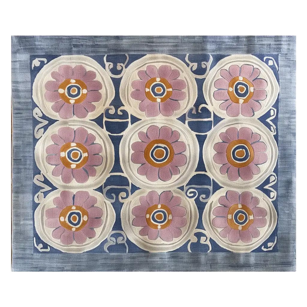 A beautifully designed area rug with a floral pattern, perfect for adding a touch of elegance to any living room. The hand-tufted wool rug showcases intricate pink and orange flowers against a blue backdrop, ideal for living room rugs sized 8x10.