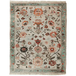 A beautifully hand-knotted area rug featuring an intricate floral design in warm tones, perfect for enhancing any living room space. This 8x10 wool rug showcases a harmonious blend of traditional patterns and vibrant colors, making it an ideal choice for those seeking a stylish floral rug.