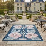 Floral patterned rug on stone patio with classical building in background