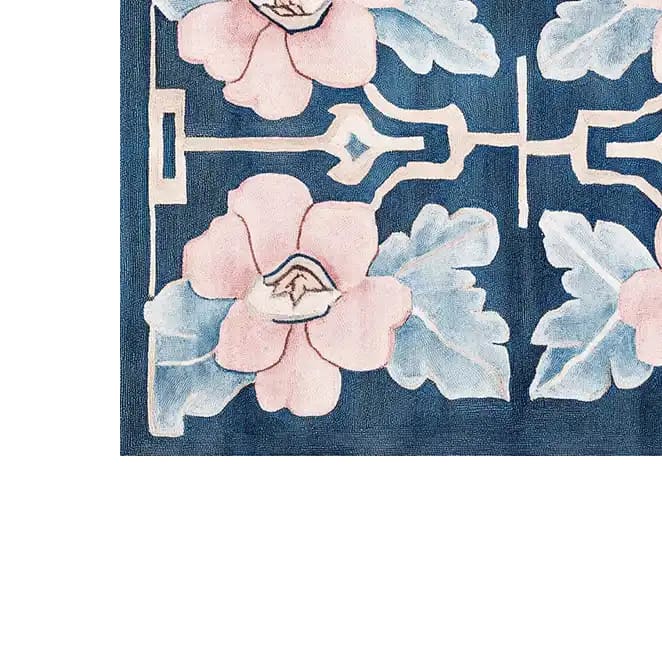 Close-up view of the Floral Symmetry Dance Hand Tufted Wool Rug, showcasing intricate floral patterns in soft pinks and blues against a deep blue background. This contemporary rug, ideal as an area rug for living rooms, adds elegance and warmth to any space. Perfectly sized as a living room rug 8x10, it's crafted from high-quality wool for a luxurious feel.