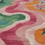 Colorful patterned rug with wavy lines and geometric shapes