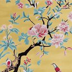 This vibrant area rug showcases a beautiful floral design with pink and red blossoms and delicate birds on a sunny yellow background. Perfect for adding a pop of color to your living room, this hand-tufted wool rug brings elegance and charm to any space.