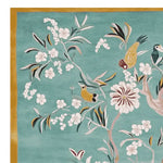 A beautiful Floral Whispers Sky Hand Tufted Rug featuring intricate bird and floral designs on a soft teal background, perfect for large living room rugs. This wool rug adds elegance and charm, making it an ideal choice for area rugs for living room settings.