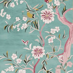 Beautiful hand-tufted wool area rug with a floral design in pastel hues, perfect for large living room spaces. The delicate blossoms and bird motifs on a sky-blue background create an elegant and serene atmosphere, ideal for enhancing any living room decor.