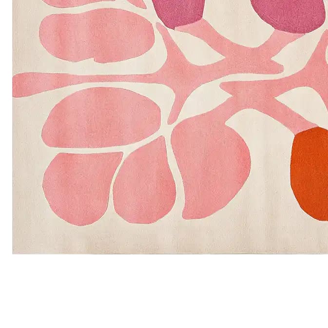 A vibrant hand-tufted wool area rug with a contemporary floral design in shades of pink, coral, and orange. Ideal for adding a pop of color to living room decor, this area rug combines modern style with the softness of wool.