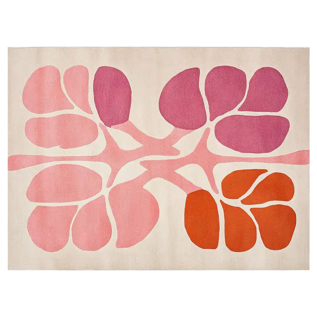 A vibrant Flower Fall Hand Tufted Wool Rug showcasing an abstract floral pattern in shades of pink and orange on a neutral background. Perfect as an area rug for living room spaces, this contemporary wool rug combines modern design with cozy texture for any home decor.
