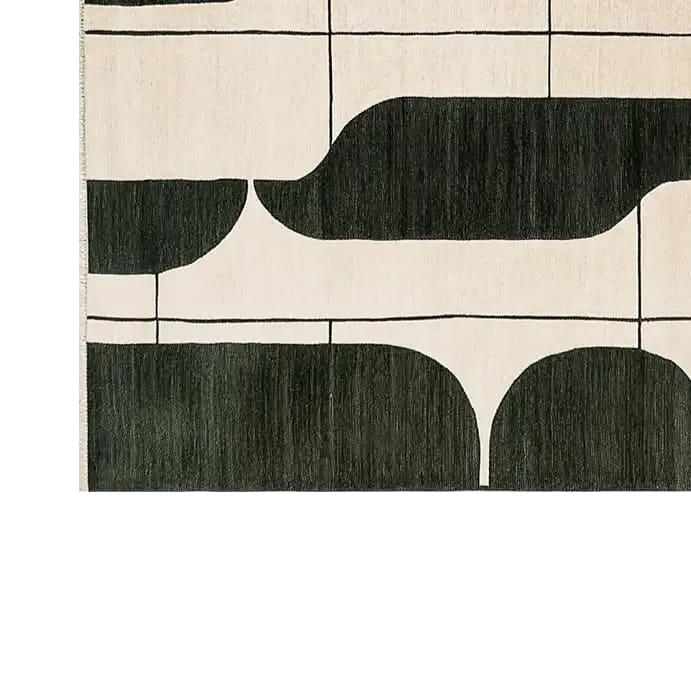 A contemporary area rug featuring an abstract black and white design. This wool rug, perfect for living room spaces, measures 8x10 and showcases bold, flowing patterns that add a modern touch to any decor.