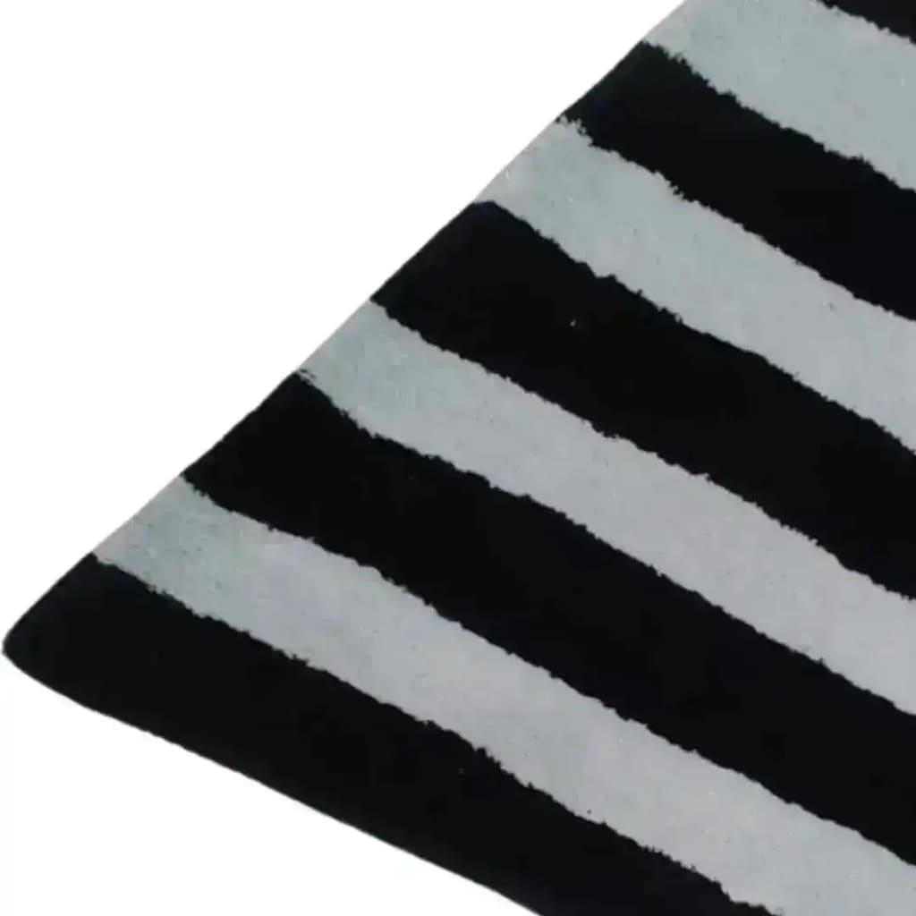 Close-up of the Flowing Illusion Black and Gray Wool Runner Rug, featuring bold black and gray stripes. Perfect for adding a contemporary touch to your living room, dining room, or as a stylish hallway runner rug. This vintage wool rug is also ideal for large living room areas and as a chic kitchen runner rug.