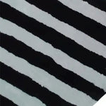 Close-up of the Flowing Illusion Black and Gray Wool Runner Rug, showcasing its bold black and gray striped pattern. Perfect as a contemporary area rug for dining rooms, kitchens, or living rooms. This vintage-inspired wool rug adds elegance to any space, whether used as a hallway runner, kitchen runner, or living room area rug.