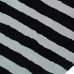 Close-up of the Flowing Illusion Black and Gray Wool Runner Rug, showcasing its bold black and gray striped pattern. Perfect as a contemporary area rug for dining rooms, kitchens, or living rooms. This vintage-inspired wool rug adds elegance to any space, whether used as a hallway runner, kitchen runner, or living room area rug.