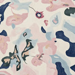 Top view of a contemporary hand-tufted area rug featuring fluid abstract shapes in pastel pink, blue, and cream tones. This wool rug is ideal for large living rooms, adding a modern and artistic touch to any space.