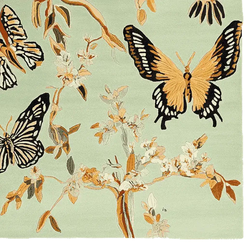 A beautifully crafted hand-tufted area rug featuring a stunning butterfly and floral design in soft, earthy tones. This wool rug is perfect for adding a touch of elegance to your living room. Ideal for those seeking large living room rugs that combine style with comfort.