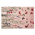 A beautifully designed area rug, titled 'Fluttering Serenity Hand Tufted Rug', showcasing a serene pattern of butterflies and flowers. The wool rug features intricate floral designs in red, blue, and green on a soft pink background, making it an ideal choice for living room area rugs.