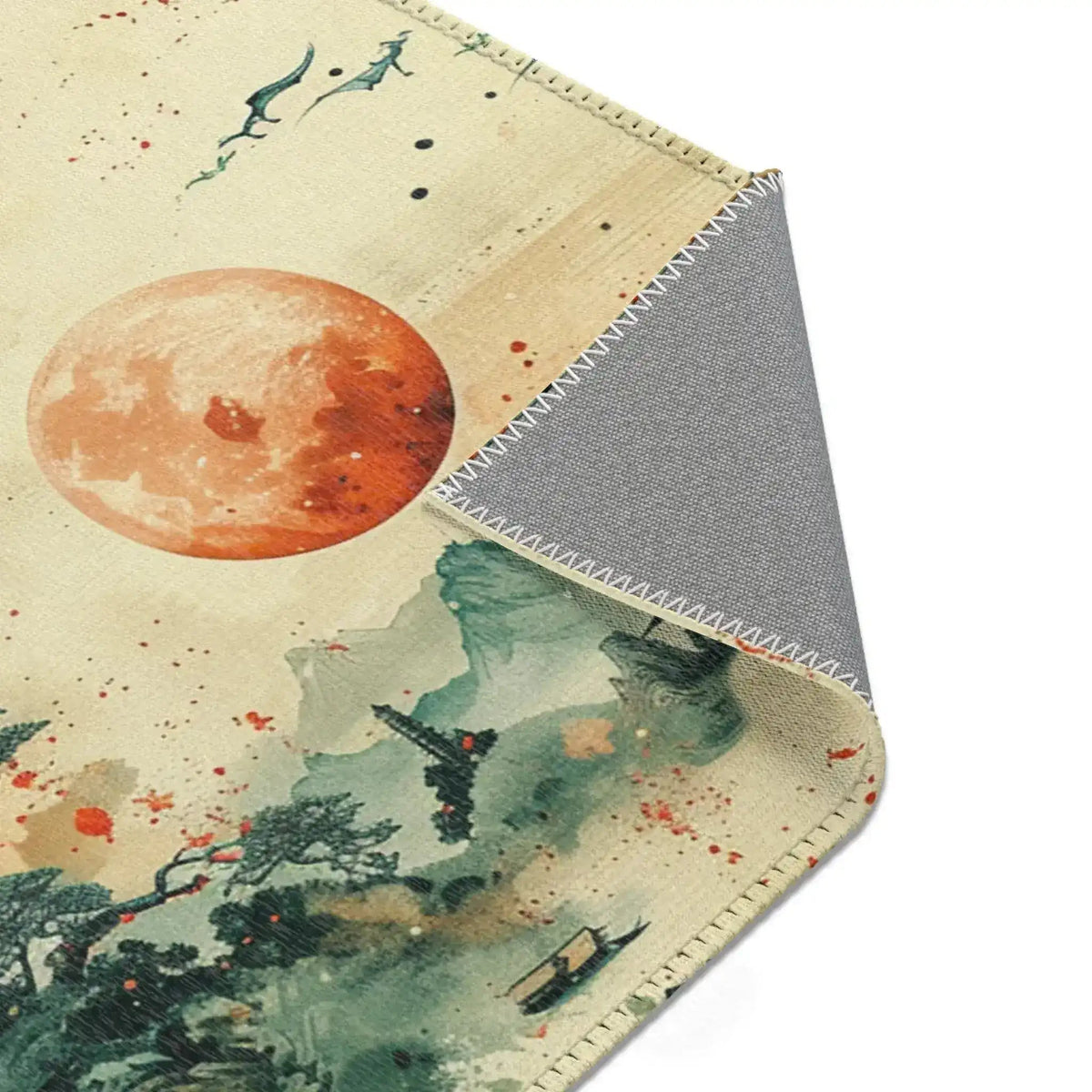 Folded corner of Moonlit Dragonscape rug, orange moon and misty scene with grey woven backing