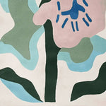 A vibrant area rug showcasing an abstract floral design with pink, blue, and green shapes. This wool rug, ideal for large living rooms, adds a contemporary touch to any space. Perfect for those seeking stylish rugs for living room decor.