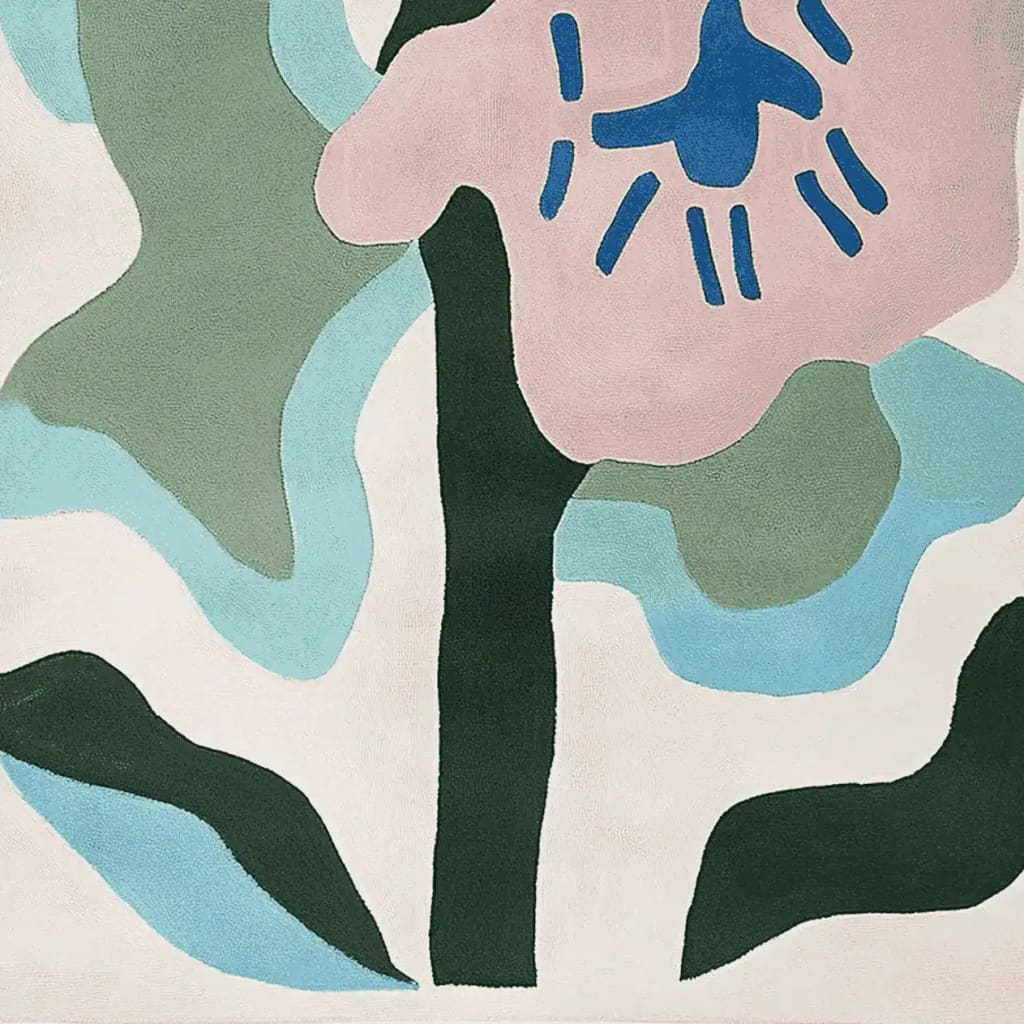 A vibrant area rug showcasing an abstract floral design with pink, blue, and green shapes. This wool rug, ideal for large living rooms, adds a contemporary touch to any space. Perfect for those seeking stylish rugs for living room decor.