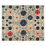 The Folk Bloom Tapestry Hand Tufted Rug showcases an intricate floral design with vibrant colors, ideal for adding a touch of elegance to your living room. This wool rug features large, detailed flowers in shades of blue, red, and beige, making it a standout piece among living room area rugs. Perfect as a large living room rug, its intricate floral pattern brings warmth and style.