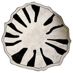 A striking round area rug in a contemporary design, featuring bold black and white abstract patterns resembling organic forms. This wool rug is perfect for large living rooms or as a centerpiece in an 8x10 space, offering a modern touch to any decor.
