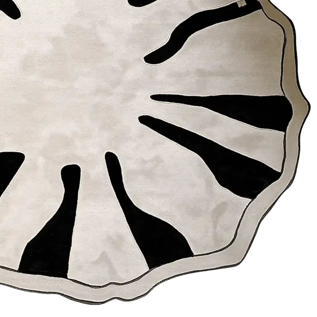 A contemporary round area rug with an abstract black and white pattern, perfect for adding a modern touch to large living rooms. This wool rug, designed in a striking 8x10 size, features a unique hand-tufted texture that enhances its artistic appeal.