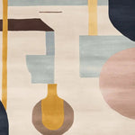 This contemporary area rug showcases an artistic blend of abstract geometric shapes in soothing tones of cream, blue, and pink, ideal for enhancing your living room space. Crafted from high-quality wool, this hand tufted rug measures 8x10, making it a perfect centerpiece for a modern living room.