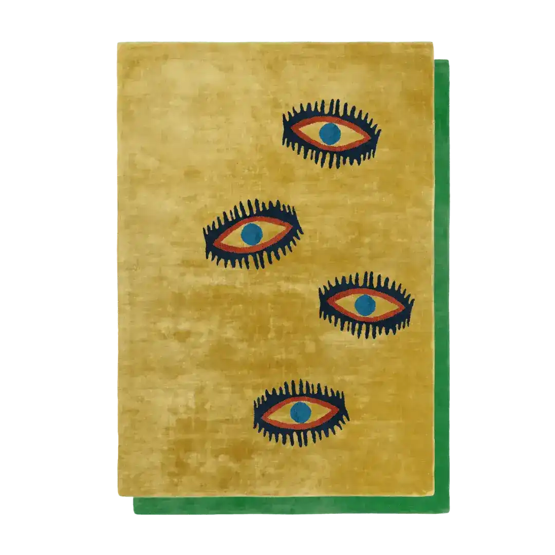 A unique area rug featuring a bold design of four stylized eyes against a warm, golden backdrop, bordered by a striking green edge. This vintage rug is perfect for adding a touch of whimsy to living room and dining room spaces. Made from high-quality viscose hand-tufted wool, it serves as an elegant and artistic choice for formal dining room settings.