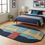 Bedroom with a colorful geometric rug on the floor, bed with blue bedding, and wall art.