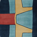 Top view of a contemporary area rug featuring an abstract design with bold colors. The wool rug displays a striking pattern with shades of blue, mustard yellow, and red, ideal for adding a modern touch to living room rugs 8x10 spaces.