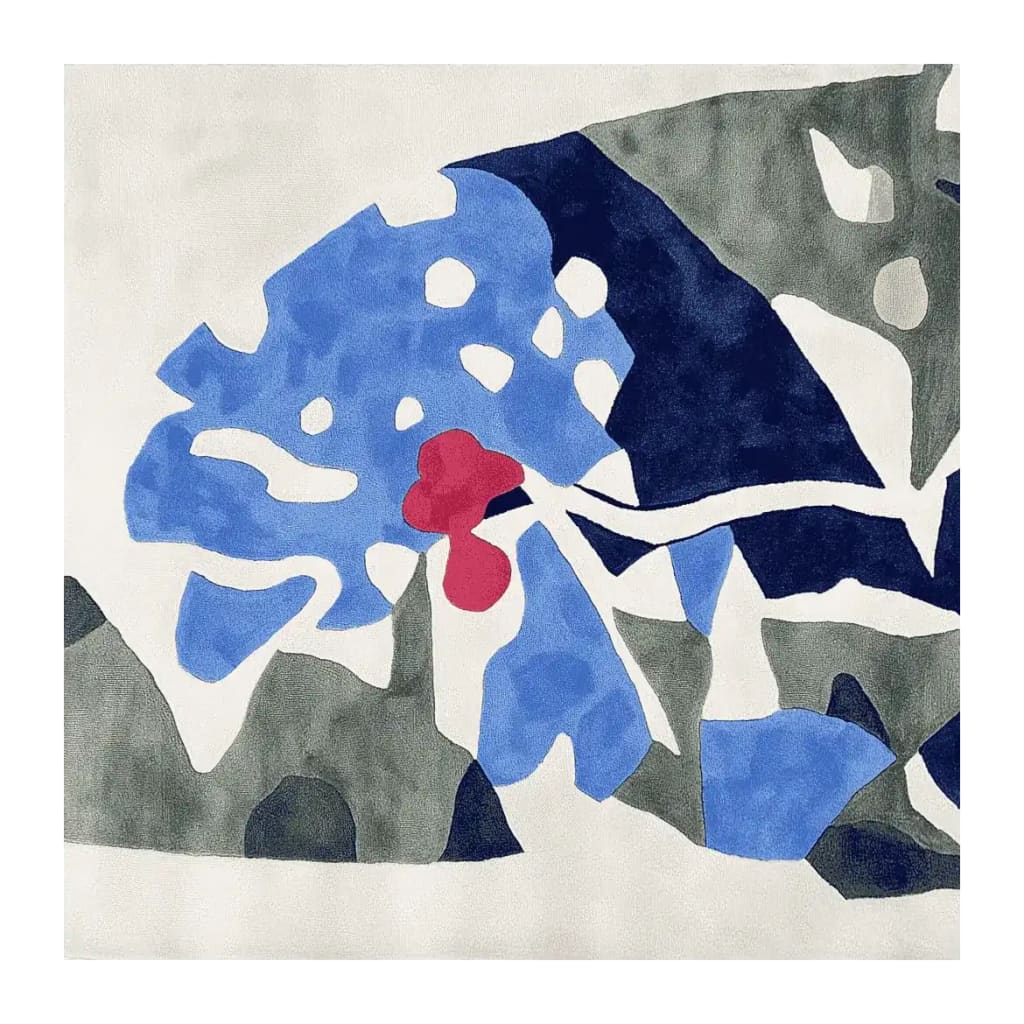 Contemporary square area rug featuring an abstract design with vibrant blue, red, and green hues. Perfect wool rug for adding a modern touch to living rooms, this hand-tufted piece combines playful shapes for a unique aesthetic.