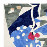 Contemporary area rug with an abstract, fragmented design featuring blue, green, and red tones. This square wool rug is perfect for a modern living room setting, adding a touch of artistic flair to any space.