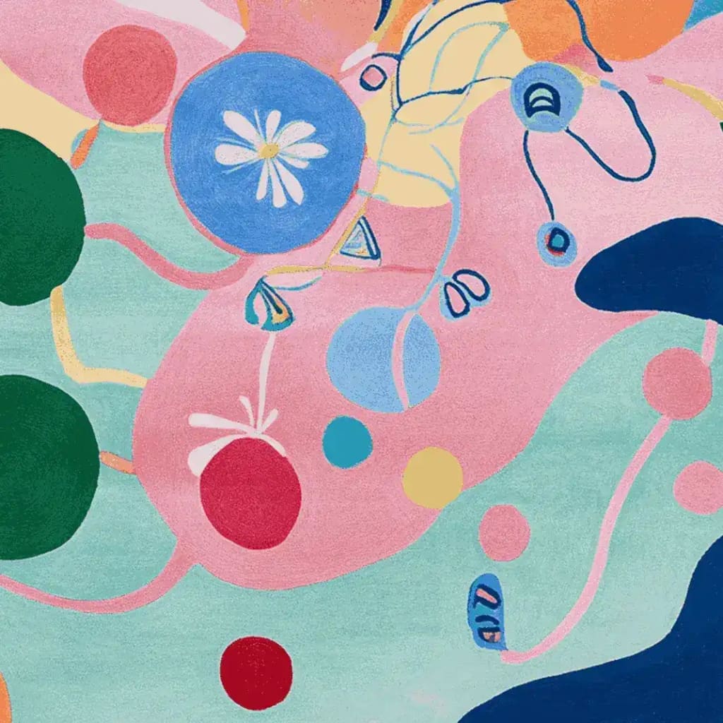 Vibrant and colorful abstract design of the Fragmented Joyscape Hand Tufted Area Rug, showcasing a mix of bold circles, lines, and shapes in pink, blue, green, and yellow hues. This contemporary wool rug is a perfect addition to living room area rugs, offering a joyful and artistic touch.