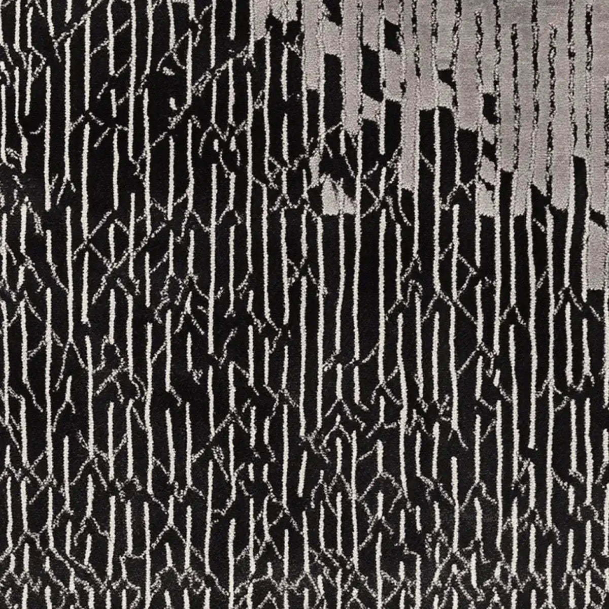 A contemporary hand tufted area rug featuring a bold black and white abstract pattern. This wool rug is perfect for adding a modern touch to living room spaces, making it an ideal choice for those seeking stylish living room area rugs.