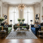 Luxurious living room with green and blue sofas, decorative pillows, and a stylish rug.