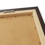 Back of framed horizontal poster in dark espresso frame, MDF backing, metal hanging bracket and fastening clips