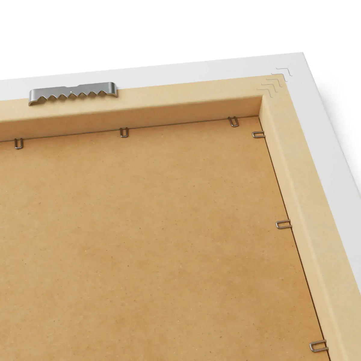 Back of framed horizontal poster in white frame, MDF board with serrated metal bracket and wire clips close-up
