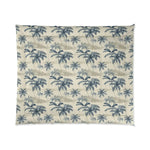 Full flat-lay of Tropical Brushstroke comforter, repeating blue palm trees on a cream quilted ground