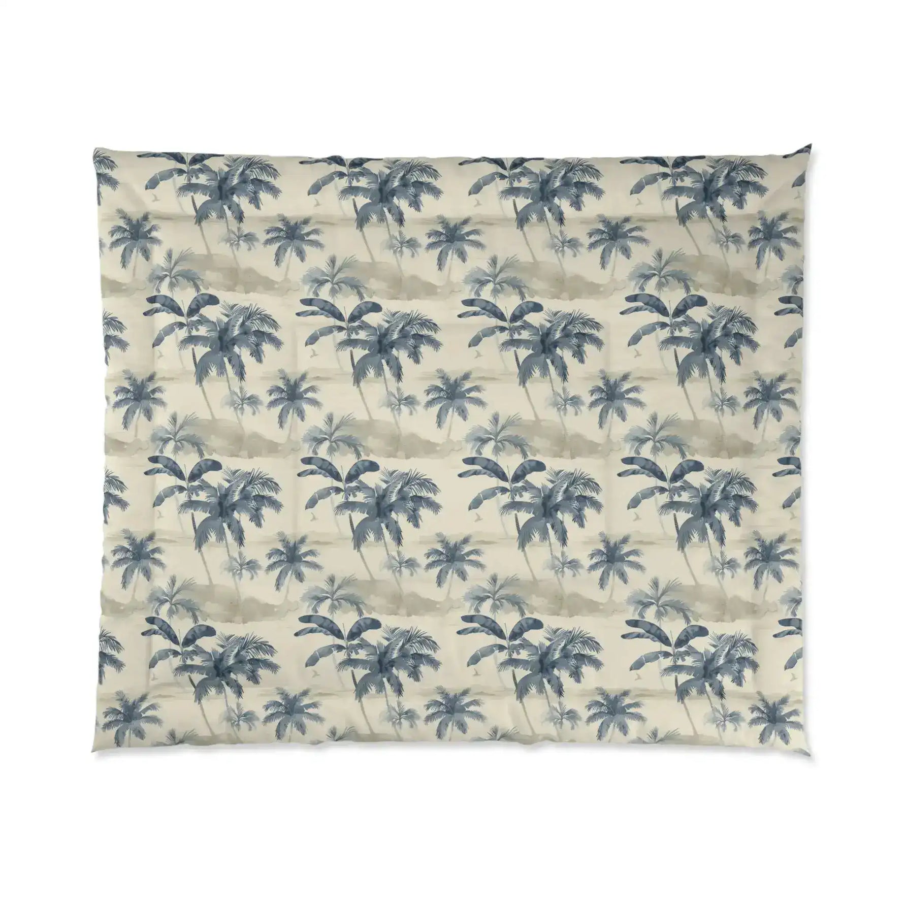 Full flat-lay of Tropical Brushstroke comforter, repeating blue palm trees on a cream quilted ground