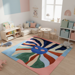 Children's room with a colorful rug, furniture, and toys.