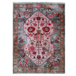 A beautifully crafted area rug featuring an enchanting floral design with vibrant pink and blue hues. Perfect for adding a touch of elegance to your living room, this knotted wool rug brings warmth and style to any space.