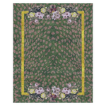 A visually striking area rug featuring an abstract design with dotted patterns in earthy tones, bordered by a vibrant yellow line and adorned with floral motifs at the top and bottom. This large area rug is perfect for adding a touch of vintage charm to a living room, crafted from high-quality wool for durability and comfort.
