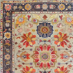 This exquisite Garden of Elegance hand-knotted area rug showcases a vibrant floral design with intricate patterns, perfect for enhancing large living room spaces. The rug features rich Persian motifs in warm tones, making it an ideal choice for those seeking elegant living room area rugs.