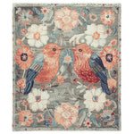 Beautiful area rug titled 'Garden of Song Whispers Hand Tufted Rug' featuring a charming floral design with birds, perfect for adding warmth and elegance to any living room. This wool rug showcases vibrant colors and intricate details, making it an ideal choice for those seeking stylish living room area rugs with a floral theme.