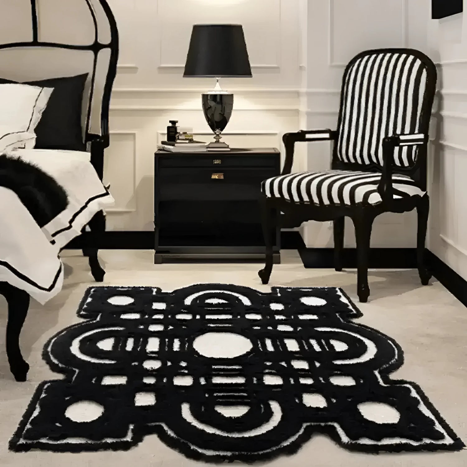 A chic and contemporary area rug with an abstract black and white geometric design, set in a stylish bedroom with classic black and white decor. Perfect for adding a modern touch to living rooms, this 8x10 living room area rug enhances the room's elegance.