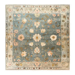 Top view of the Garden Serenity Knotted Wool Rug, showcasing an intricate floral design in soft pastel colors, ideal for enhancing living room decor. This elegant area rug is crafted from high-quality wool, making it a perfect choice for rugs for living room spaces.