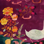 A vibrant wool area rug featuring a detailed floral and bird design, perfect for adding a touch of elegance to your bedroom or living room. The rich purple background and colorful motifs make this bedroom area rug a stunning focal point.