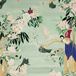 This exquisite Garden Song Hand Tufted Area Rug showcases a vibrant design featuring lush floral patterns and elegant birds against a soft green background. Perfect for adding a touch of nature-inspired beauty to large living rooms, this wool rug offers both style and comfort.