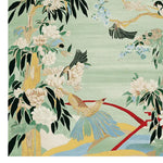 A beautifully detailed area rug featuring a vibrant design with birds and blooming flowers against a light green background. This wool rug is perfect for adding a touch of nature to your living space. Ideal for large living room areas, this hand-tufted rug combines elegance and durability.